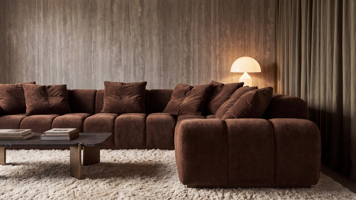 Bari Sectional in brown velvet in a living room